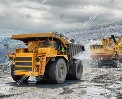 stock-photo-loading-of-iron-ore-on-very-big-dump-body-truck-99418586 1